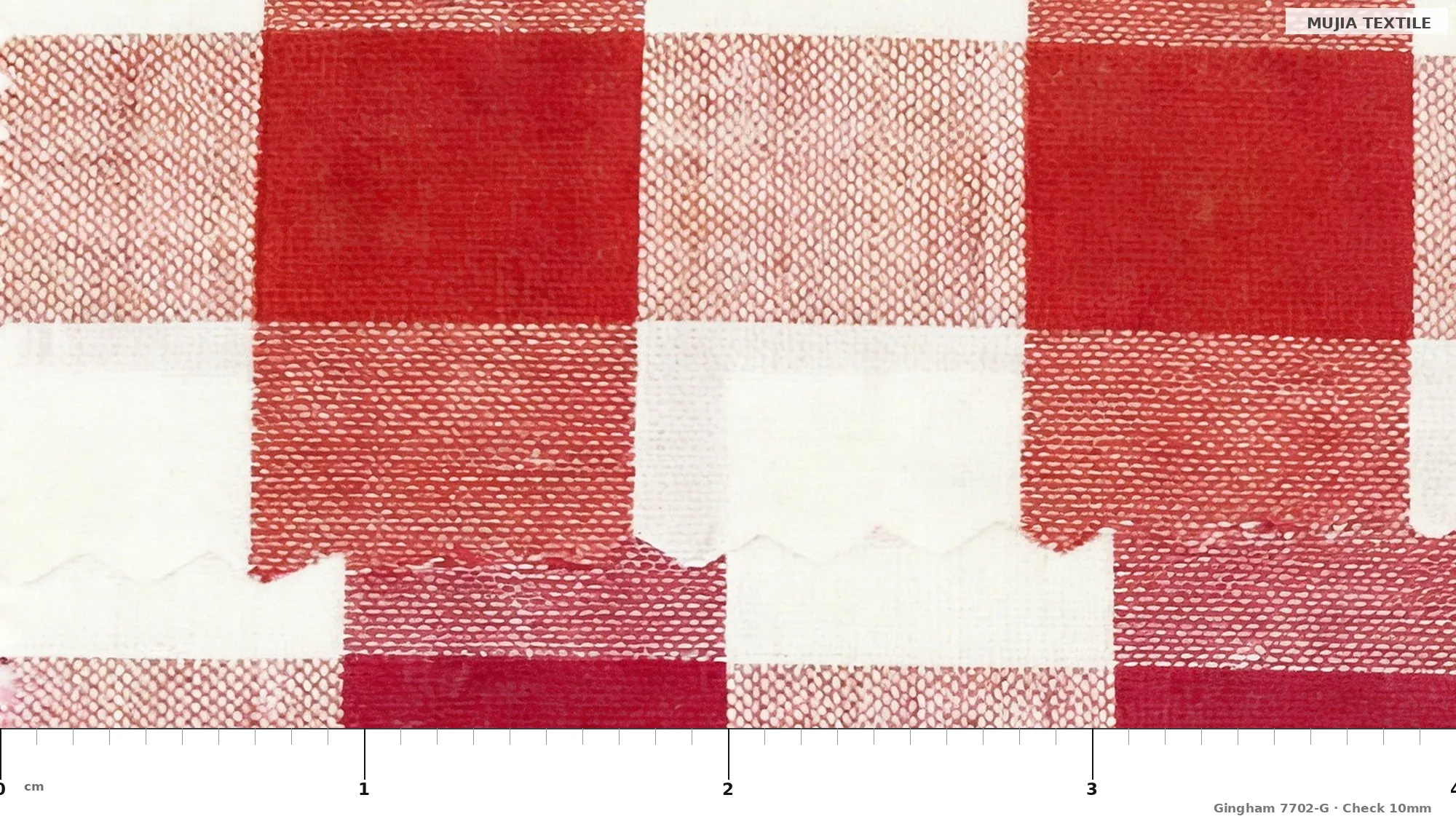 Red and white large check gingham fabric open width, steel rule showing 10 mm square size